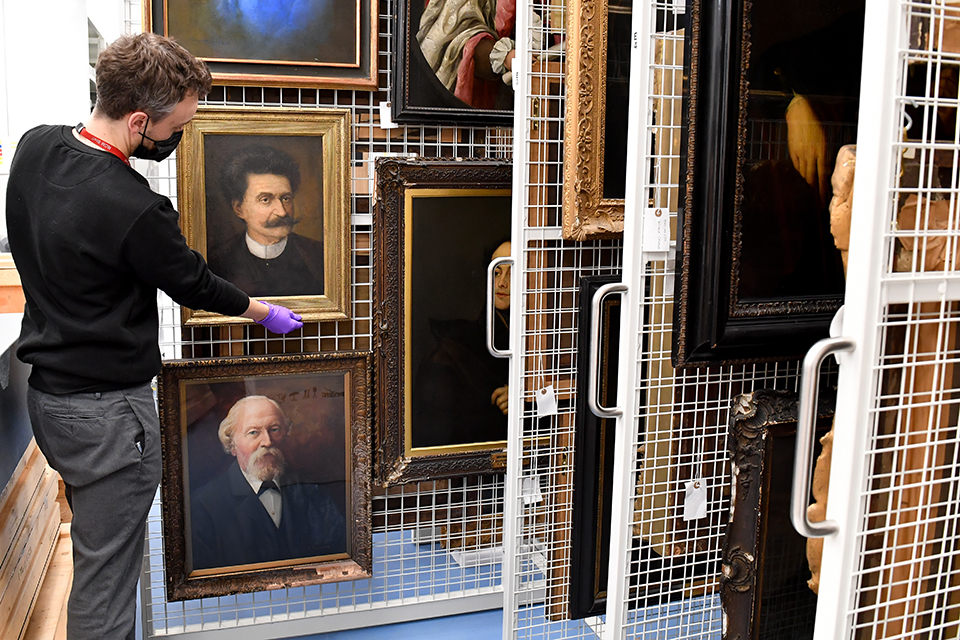 Richard Martin looking at paintings stored in the Wolfson Centretest